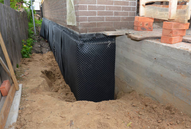 Happy homeowners after waterproofing job in Lombard